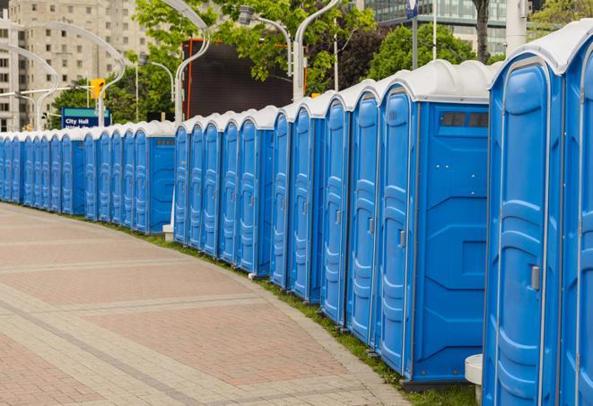 portable restrooms with sink and hand sanitizer stations, available at a festival in Alpharetta